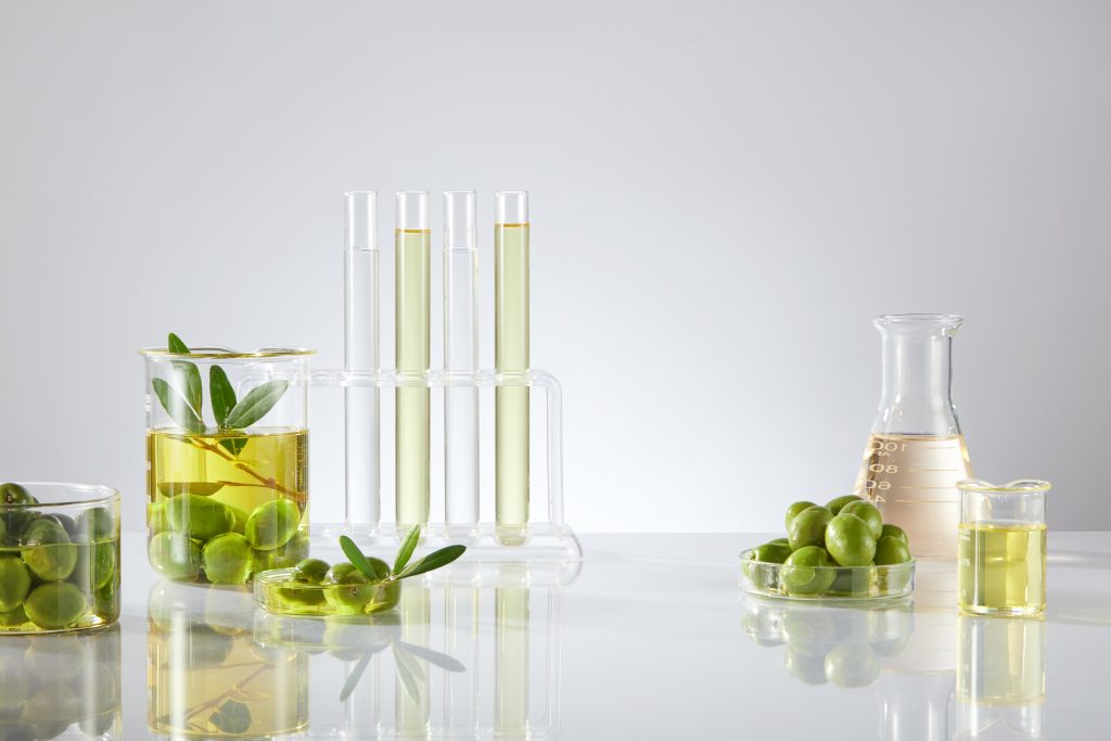 On,The,Light,Background,,Fresh,Olives,,Leaves,And,Oil,Of Image